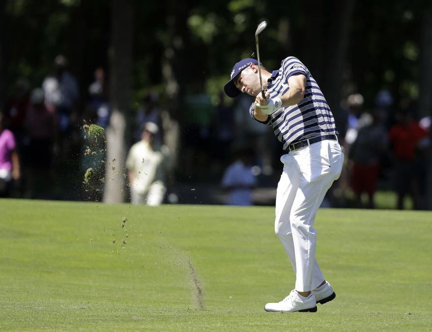 Justin Thomas hits to the ninth green during the second round of the Memorial golf tournament, Friday, June 2, 2017, in Dublin, Ohio. (AP Photo/Darron Cummings)