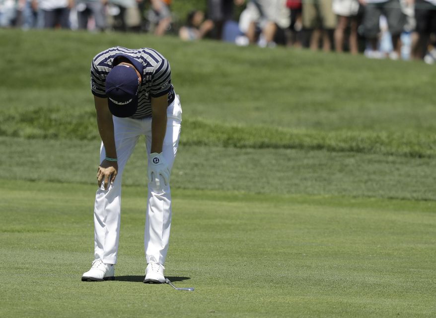 Justin Thomas reacts to his shot from the seventh fairway during the second round of the Memorial golf tournament, Friday, June 2, 2017, in Dublin, Ohio. (AP Photo/Darron Cummings)