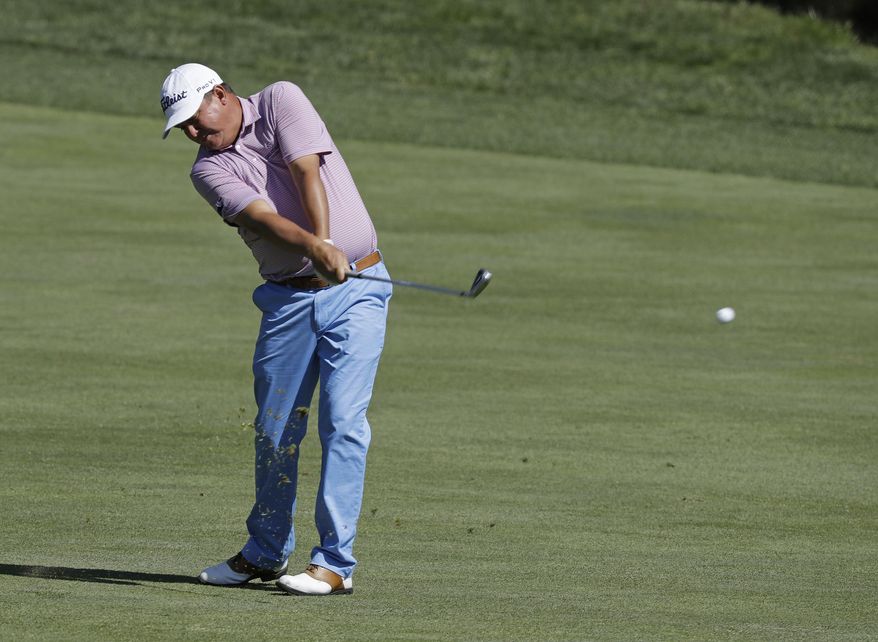 Jason Dufner hits to the 18th green during the second round of the Memorial golf tournament, Friday, June 2, 2017, in Dublin, Ohio. (AP Photo/Darron Cummings)