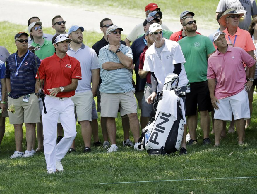 Bubba Watson watches his shot on the second hole during the third round of the Memorial golf tournament, Saturday, June 3, 2017, in Dublin, Ohio. (AP Photo/Darron Cummings)