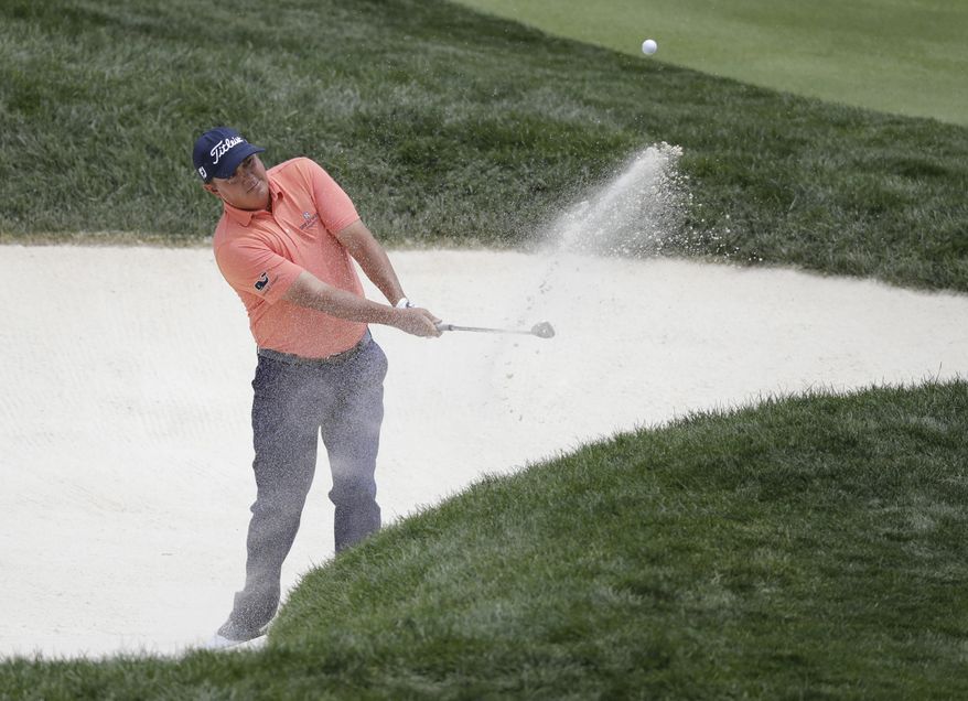 Jason Dufner hits out of a bunker on the fourth hole during the third round of the Memorial golf tournament, Saturday, June 3, 2017, in Dublin, Ohio. (AP Photo/Darron Cummings)