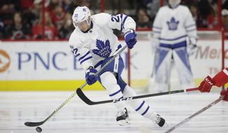 FILE - In this March 11, 2017, file photo, Toronto Maple Leafs&#39; Nikita Zaitsev (22), of Russia, skates against the Carolina Hurricanes during the first period of an NHL hockey game in Raleigh, N.C.  Zaitsev shows that Russia has become a reliable pipeline for ready-made NHL talent. (AP Photo/Gerry Broome, File)