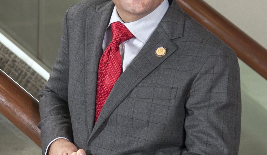 In this Aug. 21, 2015 image provided by the campaign of state Del. Glenn Davis for Lt. Governor, Davis, R-Virginia Beach, poses for a photo in Virginia Beach, Va. Davis is running against two other candidates of the Republican nomination for Lt. Governor in the June 13 primary. (Paul Chin/Davis for Lt. Governor campaign via AP)