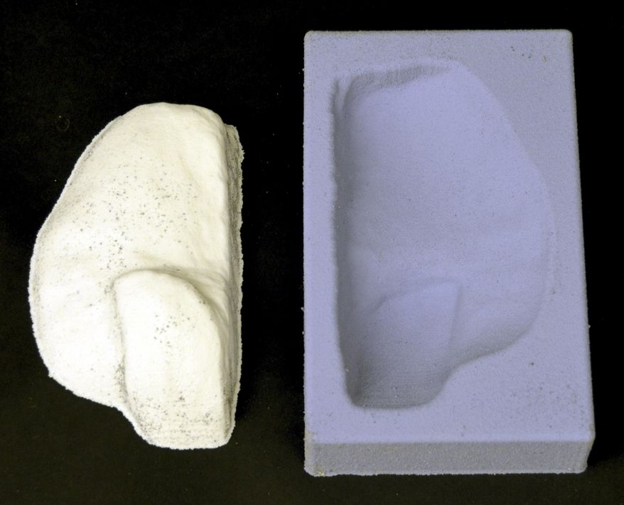 In this April 12, 2016 photo provided by Dartmouth College, a completed climbing hold, left, lies alongside its casting mold in Hanover, N.H. The hold, created by using three-dimensional geometry, is part of a replica of a rock wall created by tracking a climber's hand and foot positions and by estimating the contact forces. (Emily Whiting/Dartmouth College via AP)