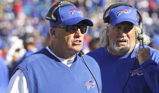 Buffalo Bills head coach Rex Ryan, left, and coach Rob Ryan work on the sidelines during the second half of an NFL football game against the Arizona Cardinals on Sunday, Sept. 25, 2016, in Orchard Park, N.Y. Buffalo won 33-18. (AP Photo/Jeffrey T. Barnes)