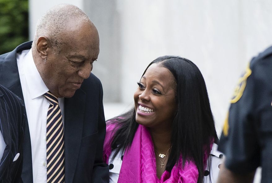 ADDS NAME - Bill Cosby arrives for his sexual assault trial with Keshia Knight Pulliam, right, at the Montgomery County Courthouse in Norristown, Pa., Monday, June 5, 2017. (AP Photo/Matt Rourke)
