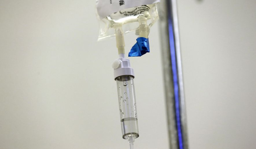 Chemotherapy drugs are administered to a patient at North Carolina Cancer Hospital in Chapel Hill, N.C., on Thursday, May 25, 2017. According to new studies released at a June 2017 American Society of Clinical Oncology conference, drugs are scoring big gains against some of the most common cancers, setting new standards of care for many prostate, breast and lung tumors. (AP Photo/Gerry Broome)