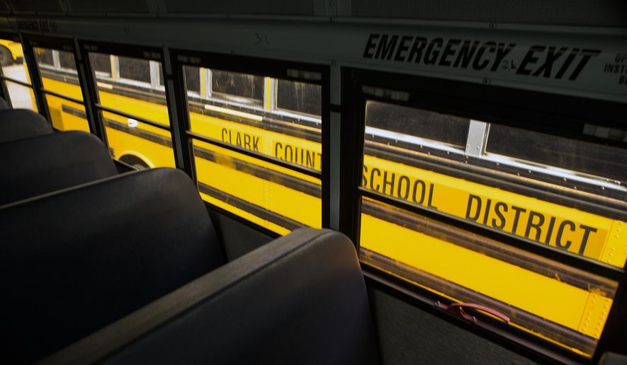 FILE - In this Jan. 23, 2017 file photo, an inside view of a decommissioned Clark County School District buses in the Northwest Bus Yard in Las Vegas. More than a dozen states are trying to take steps to keep kids in school longer, from making kindergarten mandatory to raising the legal dropout age, but it’s not an easy sell. (Jeff Scheid/Las Vegas Review-Journal via AP, File)