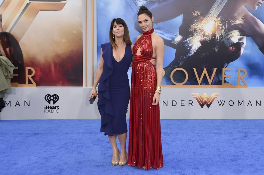 FILE - In this May 25, 2017 file photo, director Patty Jenkins, left, and actress Gal Gadot arrive at the world premiere of "Wonder Woman" at the Pantages Theatre in Los Angeles. The film grossed $103.1 million in North America over its debut weekend, a figure that easily surpassed industry expectations, set a new record for a film directed by a woman and bested all previous stand-alone female superhero movies put together. (Photo by Jordan Strauss/Invision/AP, File)