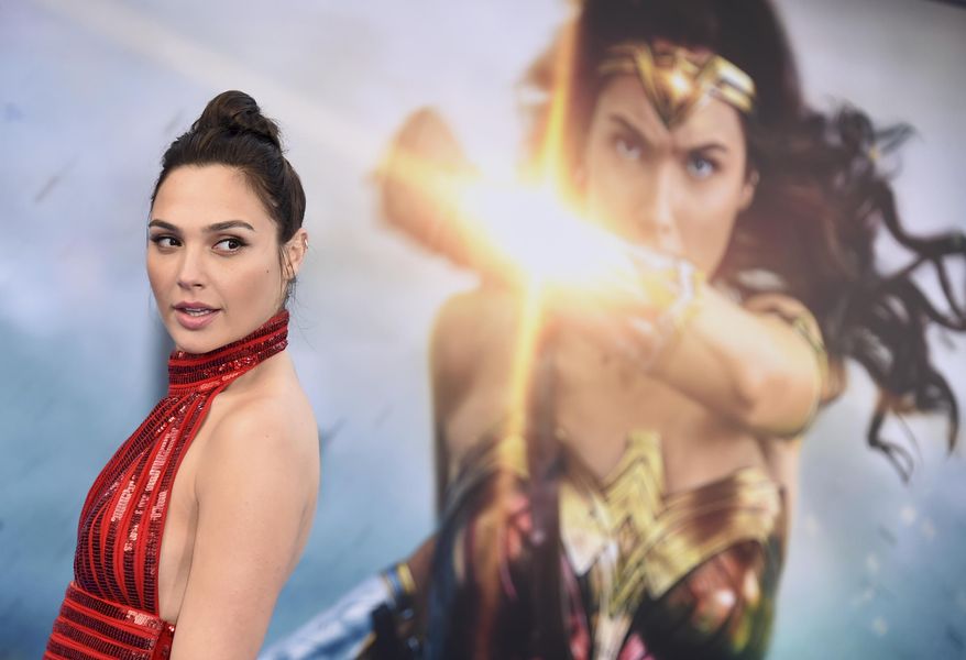 FILE - In this May 25, 2017 file photo, Gal Gadot arrives at the world premiere of "Wonder Woman" in Los Angeles. The film grossed $103.1 million in North America over its debut weekend, a figure that easily surpassed industry expectations, set a new record for a film directed by a woman and bested all previous stand-alone female superhero movies put together. (Photo by Jordan Strauss/Invision/AP, File)
