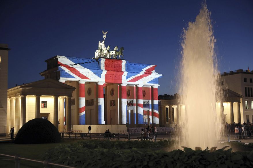 A view of the Brandenburg Gate in Berlin after it was illuminated in the colors of the British union flag Sunday June 4, 2017 as a mark of respect for the people killed in the attacks in London on Saturday night. (Joerg Carstensen/DPA via AP)