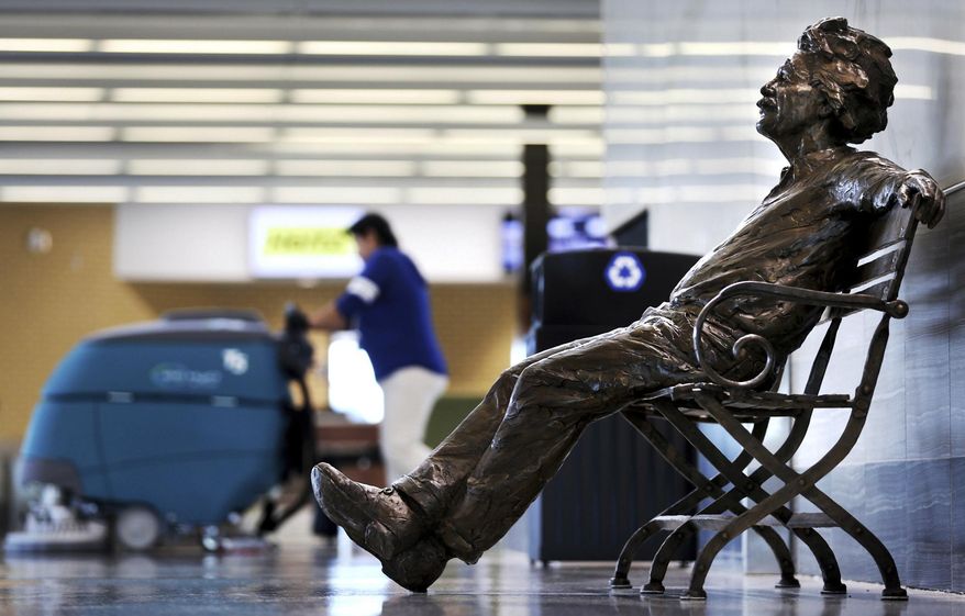 A wave of new public art pieces for Grand Island, Neb., has begun with a statue of Albert Einstein at the Central Nebraska Regional Airport in Grand Island. Grand Island businessman and developer Ray O'Connor, who donated the piece, has also donated similar statues of Mark Twain and St. Francis of Assisi. When ready, Twain will reside at the Grand Island Public Library and Assisi will be on the grounds of St. Mary's Cathedral. A group of attorneys is working to place a similar statue of George Washington at the Hall County Courthouse in Grand Island, and original pieces by artist Jun Kaneko are to be placed at Railside Plaza in downtown Grand Island on June 8. (Barrett Stinson/The Grand Island Independent via AP)