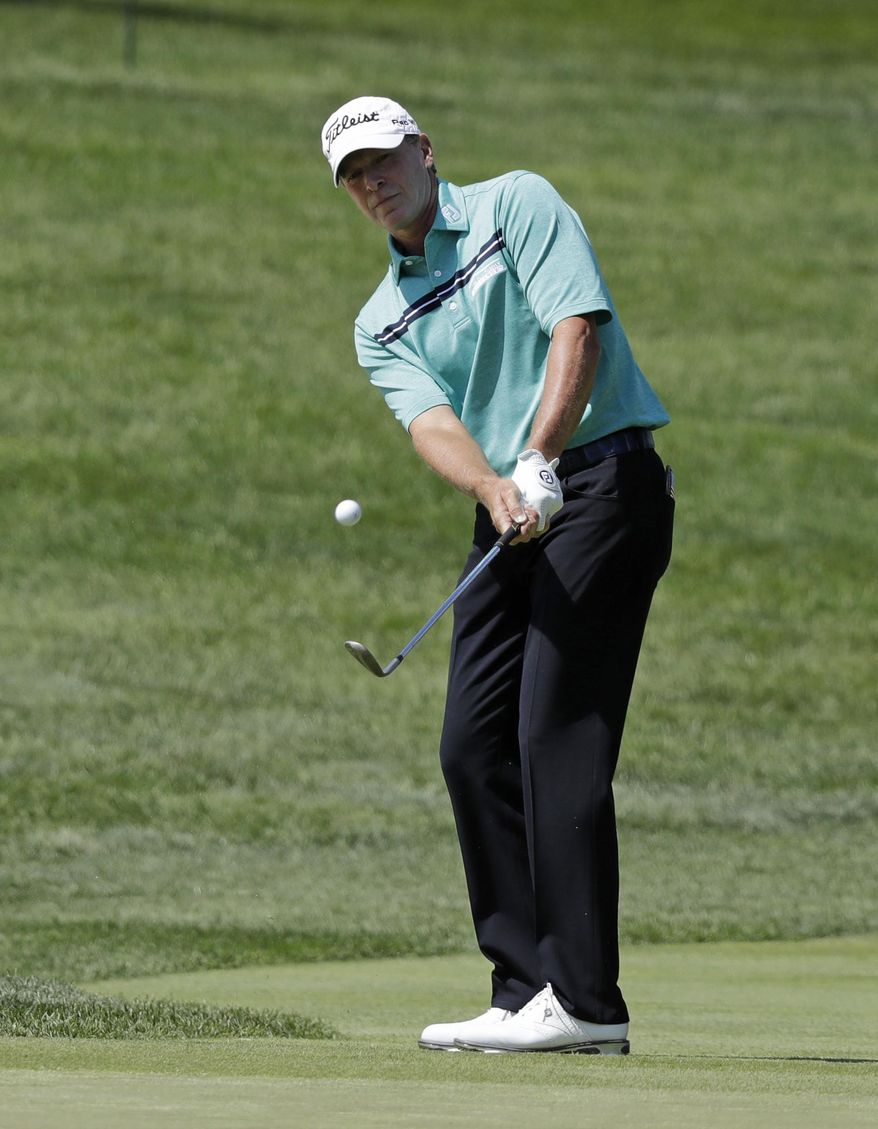 Steve Stricker chips to the first green during the third round of the Memorial golf tournament, Saturday, June 3, 2017, in Dublin, Ohio. (AP Photo/Darron Cummings)