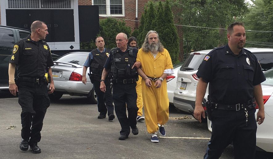 FILE- In this Aug. 2, 2016, file photo, Lee Donald Kaplan, front in yellow, and Daniel Stoltzfus, back in yellow, are led to a preliminary hearing outside Bucks County Magisterial District in Feasterville, Pa. Kaplan was convicted Tuesday, June 6, 2017, of sexually assaulting six girls in the same family, fathering two children by one of them. Authorities allege the girls' parents had "gifted" their oldest daughter to Lee Donald Kaplan because he helped the family out of financial ruin. Jurors in Bucks County convicted Kaplan, 52, on all 17 counts of rape of a child, statutory sexual assault and other offenses. The conviction came a year after a neighbor's tip prompted authorities to search his Feasterville home. (AP Photo/Megan Trimble, File)