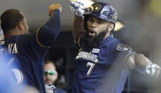 Milwaukee Brewers&#39; Eric Thames celebrates his home run during the first inning of a baseball game against the Los Angeles Dodgers Sunday, June 4, 2017, in Milwaukee. (AP Photo/Morry Gash)