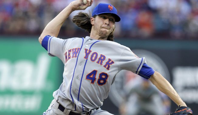 New York Mets starting pitcher Jacob deGrom throws to the Texas Rangers in the first inning of interleague baseball game, Tuesday, June 6, 2017, in Arlington, Texas. (AP Photo/Tony Gutierrez)