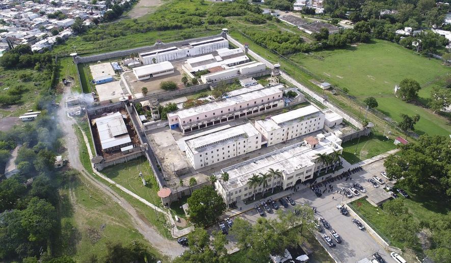 This photo released by the Tamaulipas state security spokesperson's office via Twitter and taken from a federal police helicopter shows the "Cedes" prison where authorities say two police were killed and another was wounded in Ciudad Victoria, Mexico, Tuesday, June 6, 2017. Authorities closed nearby roads, and surrounding areas were under an evacuation alert. (Tamaulipas state security spokesperson's office via AP)