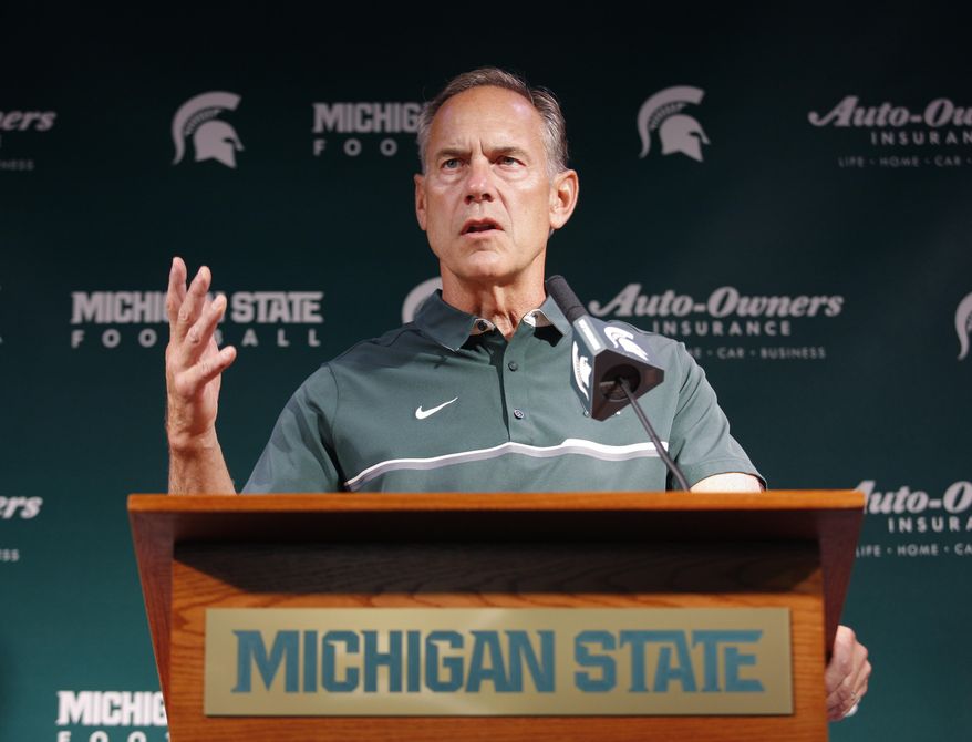 FILE - In this Aug. 8, 2016, file photo, Michigan State coach Mark Dantonio talks about the upcoming season during the team's NCAA college football media day, in East Lansing, Mich. Three Michigan State football players were charged Tuesday, June 6, 2017, with criminal sexual conduct in connection with an incident that occurred on campus in January. Coach Mark Dantonio dismissed all three players from the football program moments after the charges were made public. “Sexual assault has no place in our community, and I want to share my deep concern for the young woman affected and her family,” Dantonio said in a statement.(AP Photo/Al Goldis, File)