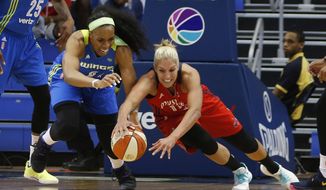 Dallas Wings forward Kayla Thornton (6) and Washington Mystics guard Elena Delle Donne (11) dive after a loose ball during the first half of a WNBA basketball game in Arlington, Texas, Tuesday, June 6, 2017. (Vernon Bryant/The Dallas Morning News via AP) **FILE**