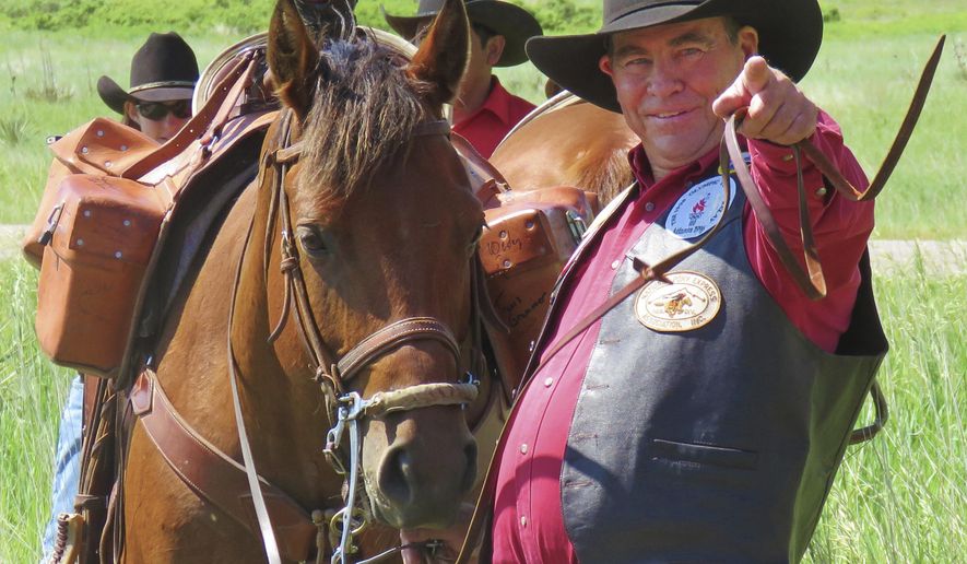 In this recent photo, Max Cawiezel, who has been directing Pony Express re-ride participants for the past 25 years, gestures in Scottsbluff, Neb. The National Pony Express Association, which keeps the memory of the short-lived mail service alive, will again relay mail by horse and rider over the famed Pony Express National Historic Trail next week to honor Nebraska's sesquicentennial. Cawiezel is in charge of the far western leg of the relay. (Steve Frederick/The Star-Herald via AP)