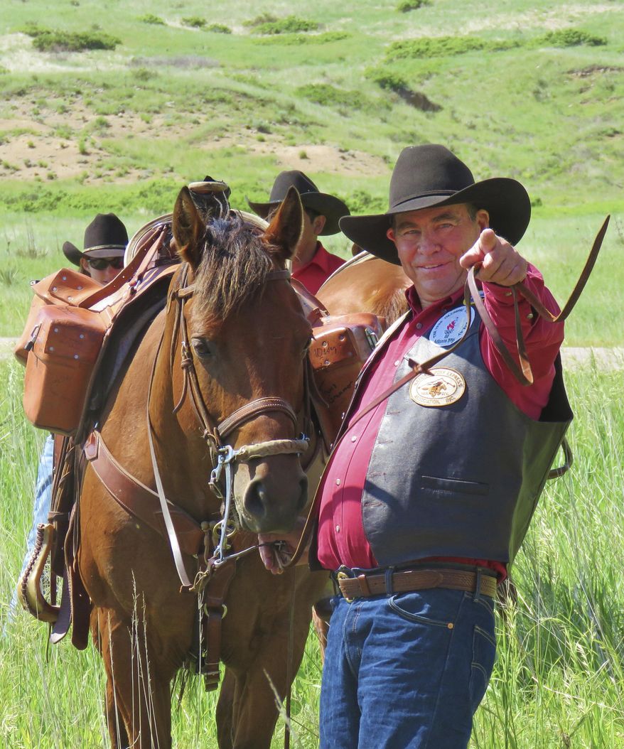 In this recent photo, Max Cawiezel, who has been directing Pony Express re-ride participants for the past 25 years, gestures in Scottsbluff, Neb. The National Pony Express Association, which keeps the memory of the short-lived mail service alive, will again relay mail by horse and rider over the famed Pony Express National Historic Trail next week to honor Nebraska's sesquicentennial. Cawiezel is in charge of the far western leg of the relay. (Steve Frederick/The Star-Herald via AP)