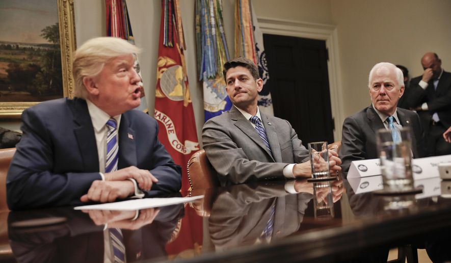House Speaker Paul Ryan of Wis., center, and Senate Majority Whip John Cornyn, R-Texas, right, listen to President Donald Trump, left, speak during Trump&#39;s meeting with House and Senate Leadership in the Roosevelt Room of the White House in Washington, Tuesday, June 6, 2017. (AP Photo/Pablo Martinez Monsivais)