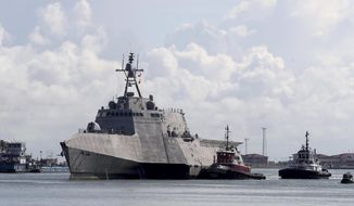 In this Saturday, June 3, 2017 photo, the U.S. Navy&#39;s newest littoral combat ship, USS Gabrielle Giffords arrives in Galveston, Texas.. The 421-foot USS Gabrielle Giffords will be commissioned this weekend in Texas. The ship is named for the former Arizona congresswoman, who in 2011 was shot but survived an assassination attempt in Tucson. (Jennifer Reynolds/The Galveston County Daily News via AP)