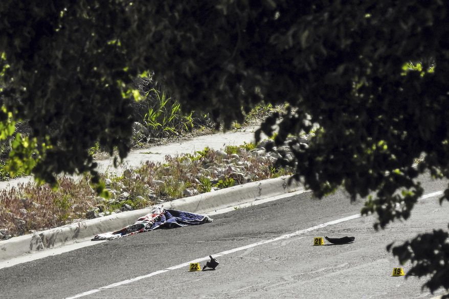 Police officers investigate the scene of a fatal shooting in Sandy, Utah, Tuesday, June 6, 2017. Utah police say the shooter in a suburban Salt Lake City neighborhood is among several people killed in the incident and two others injured were children. The shooting took place on a neighborhood street in the suburb of Sandy, about 20 miles southeast of Salt Lake City. (Chris Detrick/The Salt Lake Tribune via AP)