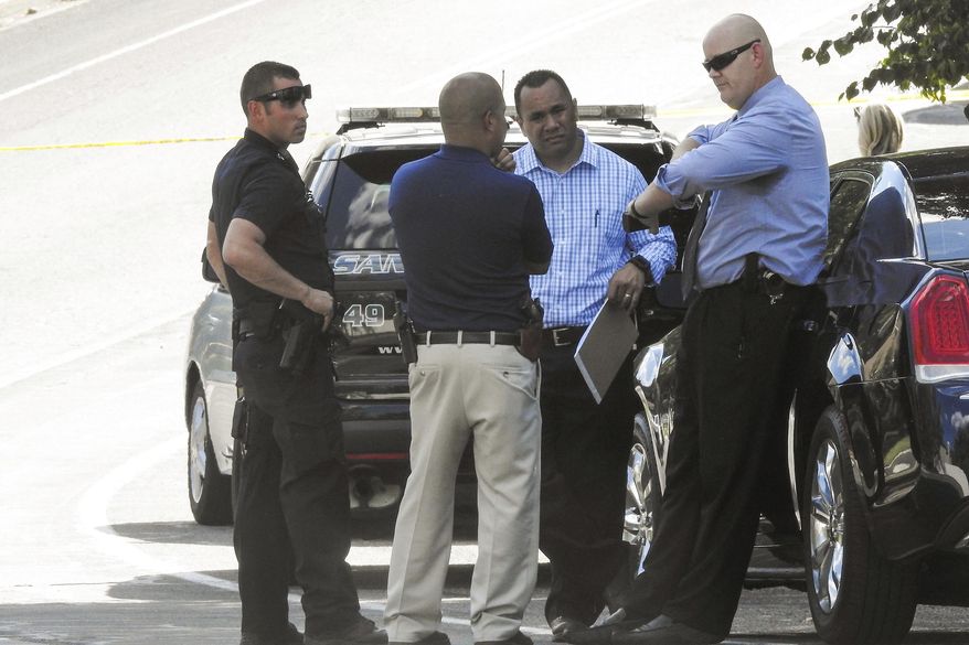 Police officers investigate the scene of a shooting in Sandy, Utah, Tuesday, June 6, 2017. Utah police say the shooter in a suburban Salt Lake City neighborhood is among several people who died in the incident and two others injured were children. The shooting took place on a neighborhood street in the suburb of Sandy, about 20 miles southeast of Salt Lake City. (Chris Detrick/The Salt Lake Tribune via AP)