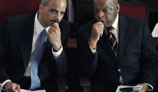 In this March 8, 2009, file photo, U.S. Attorney General Eric Holder, left, shares a moment with Rep. John Lewis, D-Ga., prior to being introduced at the Brown AME Chapel in Selma, Ala., on the 44th anniversary of the Voting Rights March. Holder is being honored for his service to the cause of civil rights from the Washington Lawyers’ Committee for Civil Rights and Urban Affairs on Wednesday and Lewis will present the award to Holder. (AP Photo/Kevin Glackmeyer)