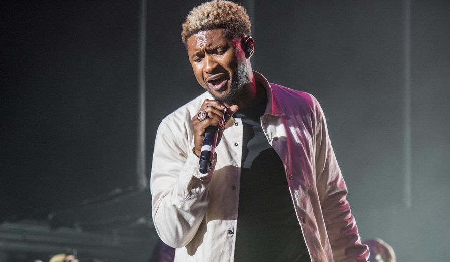 FILE - In this April 29, 2017, file photo, Usher performs with Trombone Shorty and Orleans Avenue in New Orleans. Usher will attend the 2017 Songwriters Hall of Fame event inducting Jay Z and Berry Gordy on June 15 in New York. (Photo by Amy Harris/Invision/AP, File)