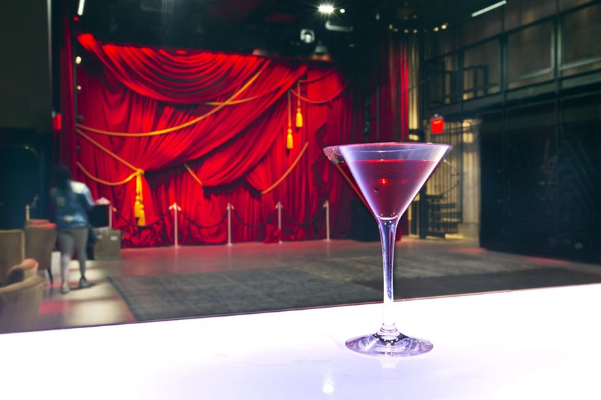In this June 1, 2017 photo, a cocktail rests on a bar at The PUBLIC Arts space of the PUBLIC hotel in New York. The new hotel on Manhattan's Lower East Side opens Wednesday, June 7. It is the latest project from Ian Schrager, who's known for introducing the concept of boutique hotels and as co-founder of the legendary disco Studio 54. (AP Photo/Richard Drew)
