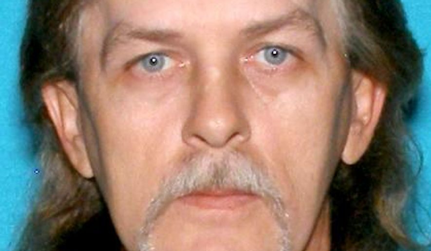 Richard Lee Burton Jr., who Indiana State Police believe killed three people at a house he shared with the victims in rural southern Indiana, is shown in this driver's license photo released by the Indiana Bureau of Motor Vehicles. The bodies of two males and one female were found Sunday, June 4, 2017, in a home near Salem, Indiana, they shared with Burton. State Police said a body found Monday in a pickup truck near Bloomington, Indiana, is believed to be that of Burton, 47. Autopsies are scheduled for Tuesday on the three victims and the man who's believed to be Burton. (Indiana Bureau of Motor Vehicles via AP)