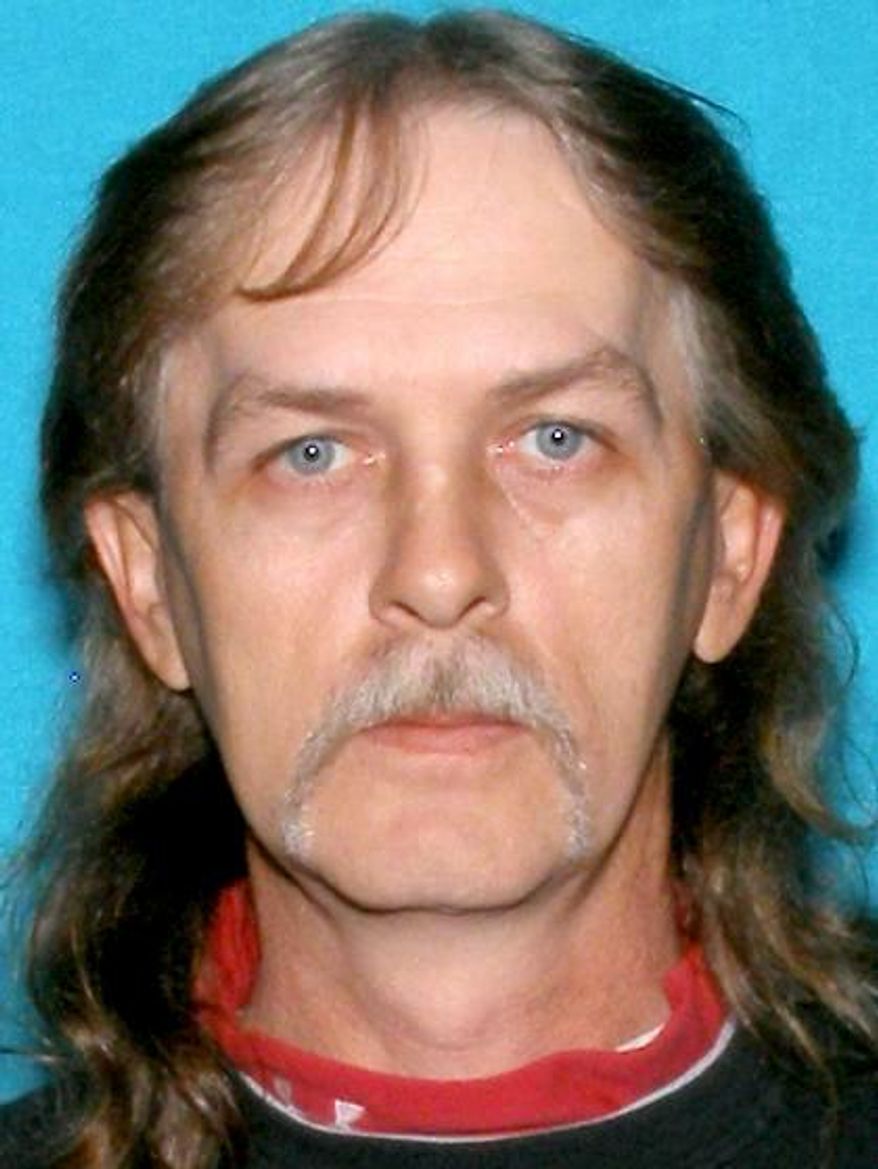 Richard Lee Burton Jr., who Indiana State Police believe killed three people at a house he shared with the victims in rural southern Indiana, is shown in this driver's license photo released by the Indiana Bureau of Motor Vehicles. The bodies of two males and one female were found Sunday, June 4, 2017, in a home near Salem, Indiana, they shared with Burton. State Police said a body found Monday in a pickup truck near Bloomington, Indiana, is believed to be that of Burton, 47. Autopsies are scheduled for Tuesday on the three victims and the man who's believed to be Burton. (Indiana Bureau of Motor Vehicles via AP)