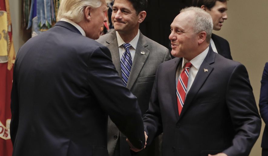 President Donald Trump, left, greets House Majority Whip Steve Scalise of La., before the start of a meeting with House and Senate Leadership in the Roosevelt Room of the White House in Washington, Tuesday, June 6, 2017. Also in the room are House Speaker Paul Ryan of Wis., center, and Senior adviser to President Donald Trump Jared Kushner, far right. (AP Photo/Pablo Martinez Monsivais)