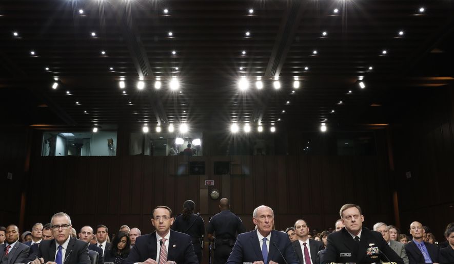 From left, Acting FBI Director Andrew McCabe, Deputy Attorney General Rod Rosenstein, National Intelligence Director Dan Coats, and National Security Agency Director Adm. Michael Rogers are seated during a Senate Intelligence Committee hearing about the Foreign Intelligence Surveillance Act, on Capitol Hill, Wednesday, June 7, 2017, in Washington. (AP Photo/Alex Brandon)
