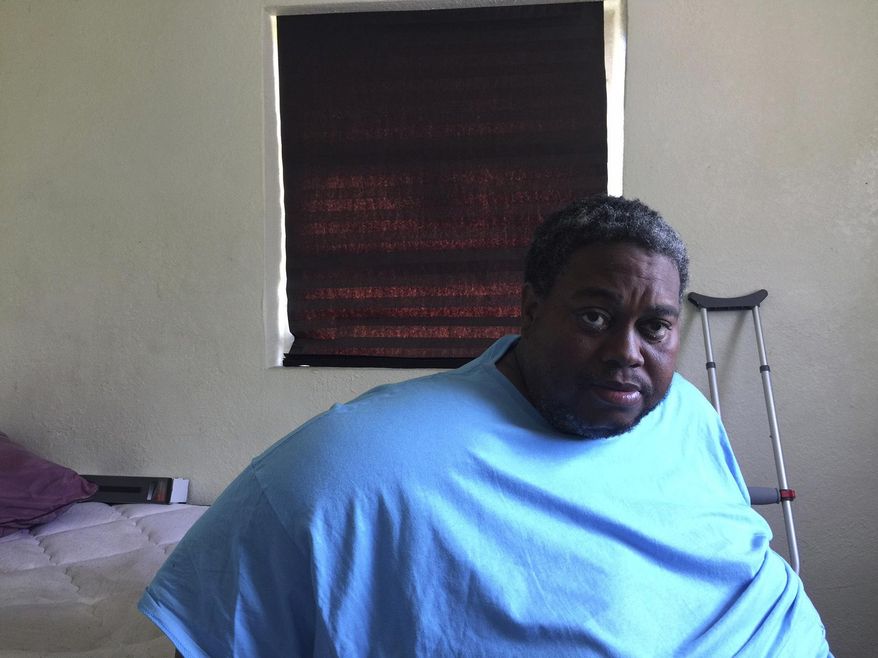 Darryl Henderson at the South Bay home of a childhood friend, Taurance Lovely. (Wayne Washington /Palm Beach Post via AP)