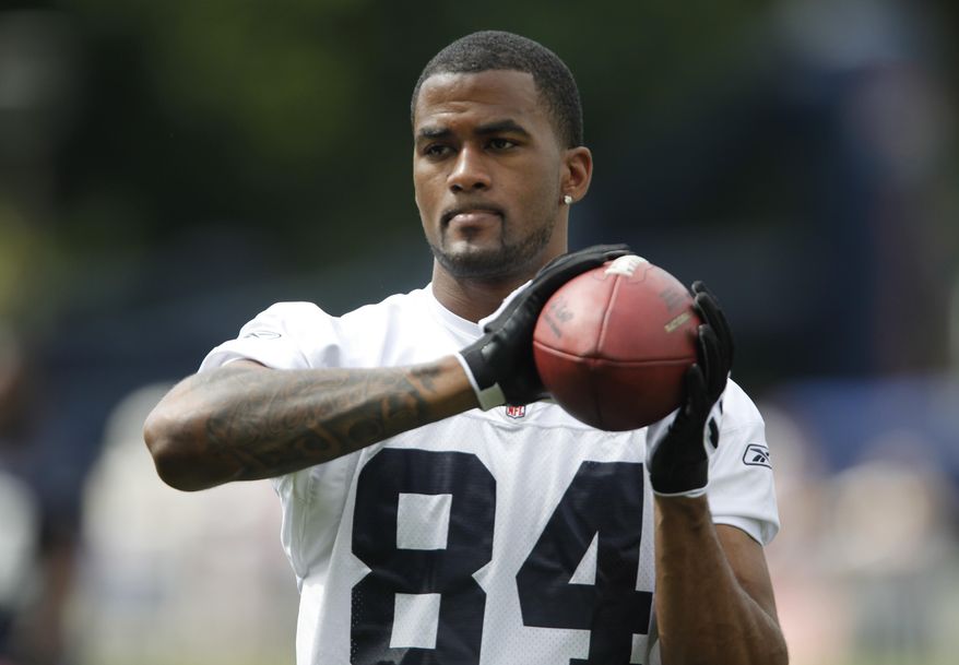 FILE - In this July 27, 2009, file photo, Buffalo Bills' James Hardy catches a pas during NFL football training camp at St. John Fisher College in Pittsford, N.Y., Authorities say the former NFL wide receiver has been found dead in a river in northeast Indiana. The Allen County Coroner's Office says the 31-year-old's body was identified Thursday, June 8, 2017, but that the cause and manner of death are still being investigated. His body was discovered the Wednesday in the Maumee River in Fort Wayne, Ind. (AP Photo/David Duprey, File)