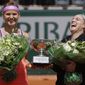 FILE - In this June 7, 2015 file photo, Bethanie Mattek-Sands of the U.S., right, and Lucie Safarova of the Czech Republic, left, hold the trophy after winning the women&#39;s doubles final of the French Open tennis tournament. As a professional athlete who is judicious about what she eats and drinks, Bethanie Mattek-Sands knows all too well how impossible it is to avoid the sweet aroma emanating from a stand selling waffles with a chocolate-hazelnut spread just outside the French Open&#39;s main stadium. (AP Photo/Thibault Camus, File)