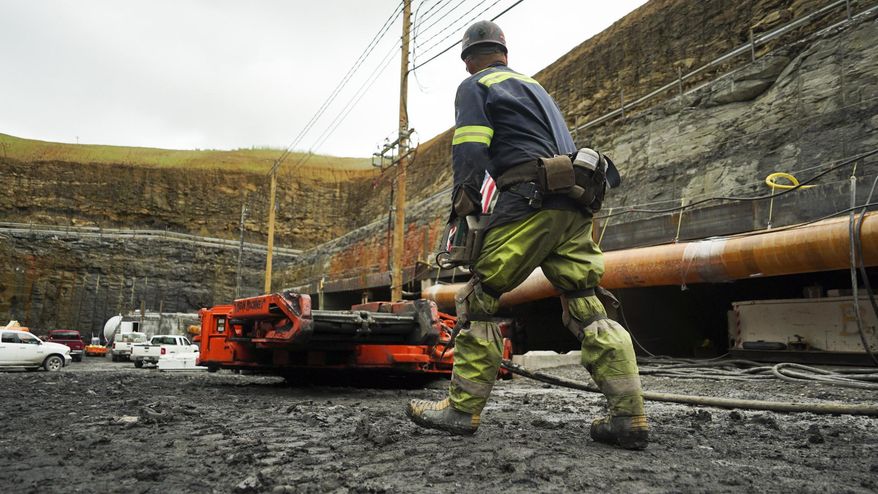 A worker runs a miner machine at a coal mine in Friedens, Pa., Wednesday, June 7, 2017. Corsa Coal Corp. says the mine will create 70 to 100 new jobs and produce some 400,000 tons of metallurgical coal a year. President Donald Trump referred to the mine's opening during a speech announcing his intent to withdraw from the Paris climate accords. (AP Photo/Dake Kang)