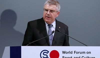 FILE - In this Thursday, Oct. 20, 2016 file photo, International Olympic Committee President Thomas Bach delivers a speech at World Forum on Sports and Culture in Tokyo. Los Angeles and Paris should edge closer Friday, June 9, 2017 to both getting Olympic host city rights later this year. The expected agreement would fulfill IOC President Thomas Bach’s wish to avoid making a loser of either world-class candidate, though it must be ratified by the Olympic body’s voting members. (AP Photo/Eugene Hoshiko, File)
