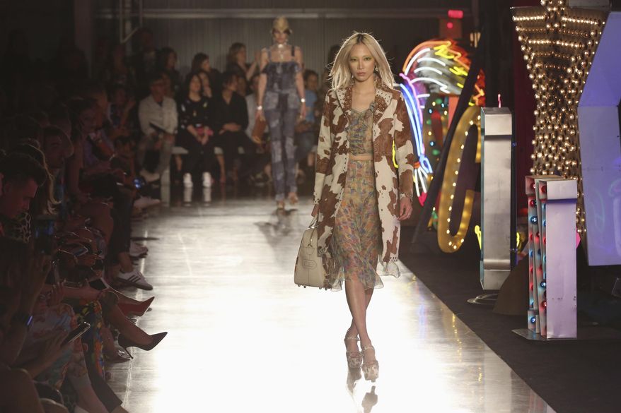 Models walk down the runway at the Moschino fashion show at MADE Fashion Festival on Thursday, June 8, 2017, in Los Angeles. (Photo by Willy Sanjuan/Invision/AP)
