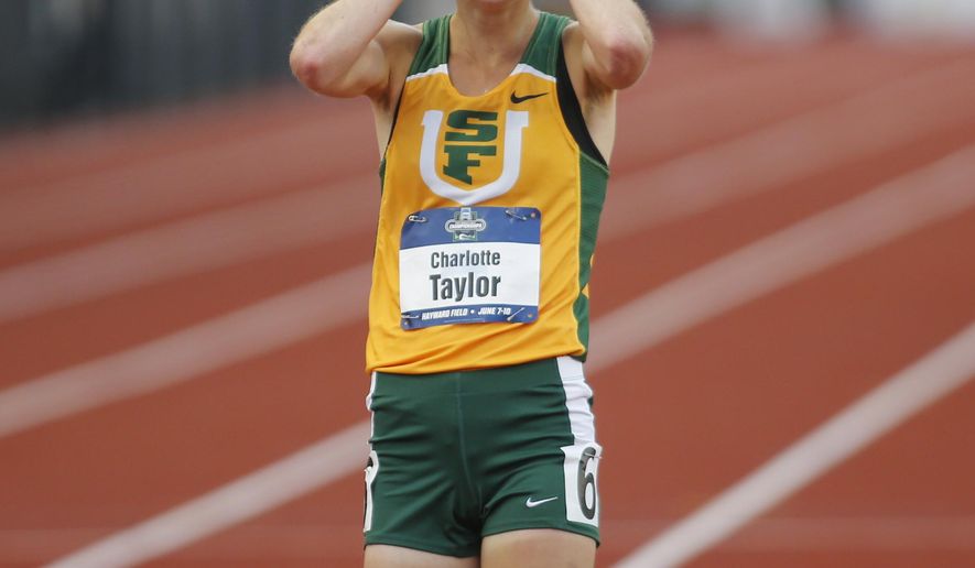 San Francisco's Charlotte Taylor reacts to her victory in the women's 10,000 meters on the second day of the NCAA outdoor college track and field championships in Eugene, Ore., Thursday, June 8, 2017. Taylor won the race in 32 minutes, 38.57 seconds. (AP Photo/Timothy J. Gonzalez)