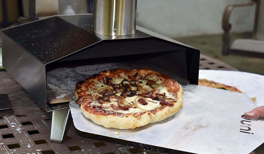 The Uuni 3 pizza oven in action. (Photograph by Joseph Szadkowski / The Washington Times)
