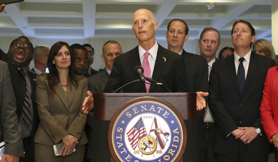 Gov. Rick Scott speaks to legislators at the end of the special session, Friday, June 9, 2017, in Tallahassee, Fla. (AP Photo/Steve Cannon)