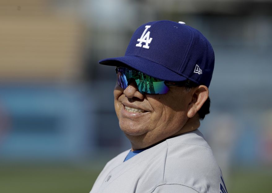 Former Los Angeles Dodgers pitcher Fernando Valenzuela smiles during batting practice before an old-timers baseball game in Los Angeles, Saturday, June 10, 2017. (AP Photo/Chris Carlson)