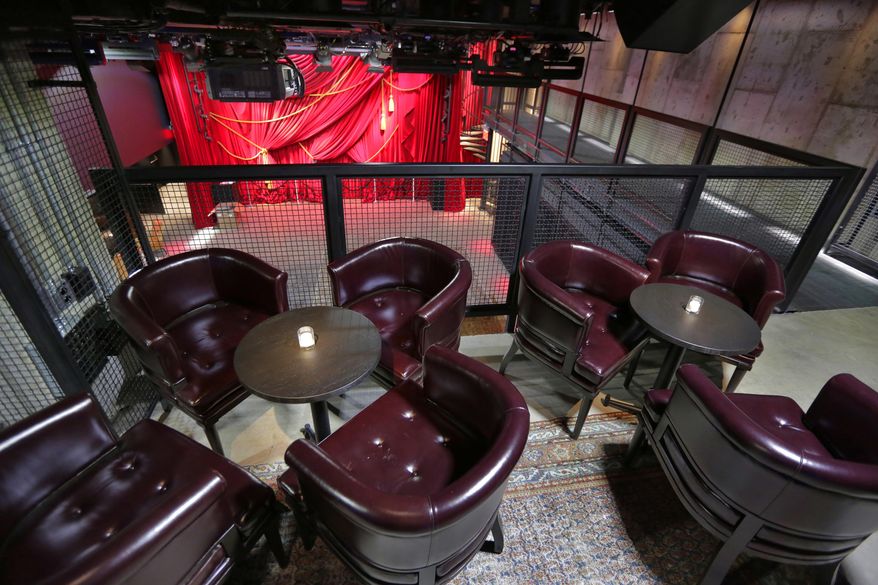 This June 1, 2017 photo shows a lounge area overlooking the Public Art space of the PUBLIC hotel, in New York. (AP Photo/Richard Drew)