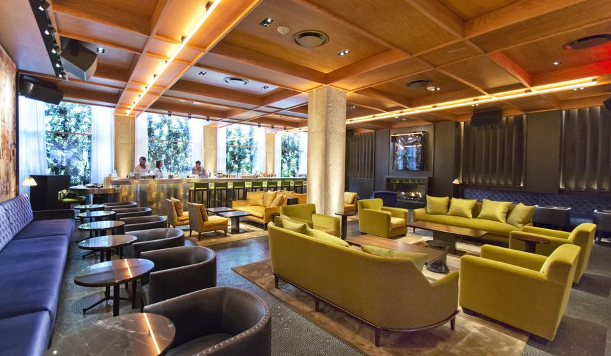 This June 1, 2017 photo shows a general view of The Diego bar, with colors inspired by artwork from Mexican artist Diego Rivera, at the PUBLIC hotel, in New York. (AP Photo/Richard Drew)