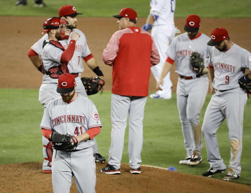 Cincinnati Reds relief pitcher Jake Buchanan leaves the field after being taken out of the baseball game during the fourth inning against the Los Angeles Dodgers in Los Angeles, Friday, June 9, 2017. (AP Photo/Chris Carlson)