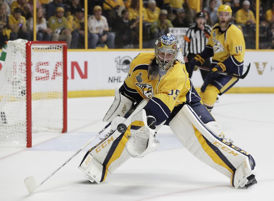 Nashville Predators goalie Pekka Rinne (35), of Finland, blocks a shot during the second period of Game 6 of the NHL hockey Stanley Cup Final against the Pittsburgh Penguins, Sunday, June 11, 2017, in Nashville, Tenn. (AP Photo/Mark Humphrey)